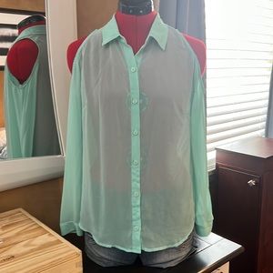 Sheer button down shirt with exposed shoulders.
